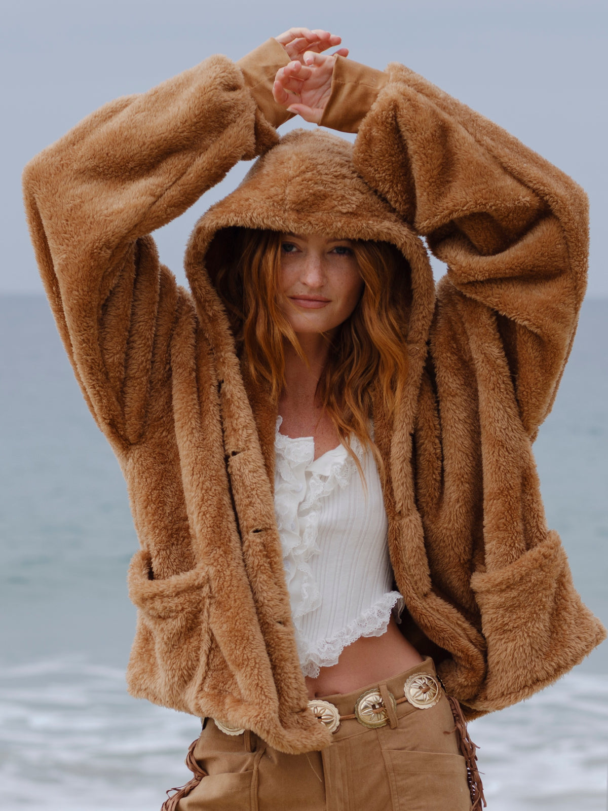 Camel Brown Crop Papàsweater modeled on the beach