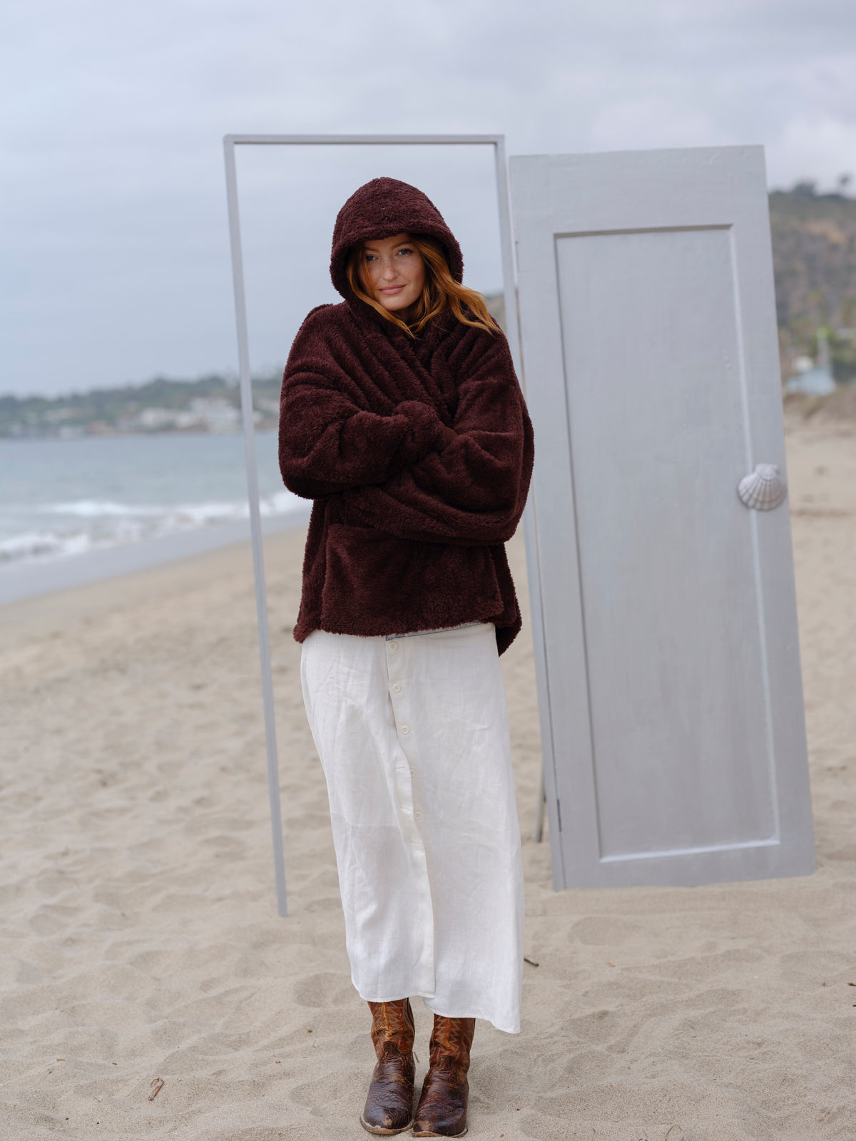 Dark Chocolate Crop Papàsweater modeled on the beach
