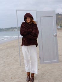 Dark Chocolate Crop Papàsweater modeled on the beach