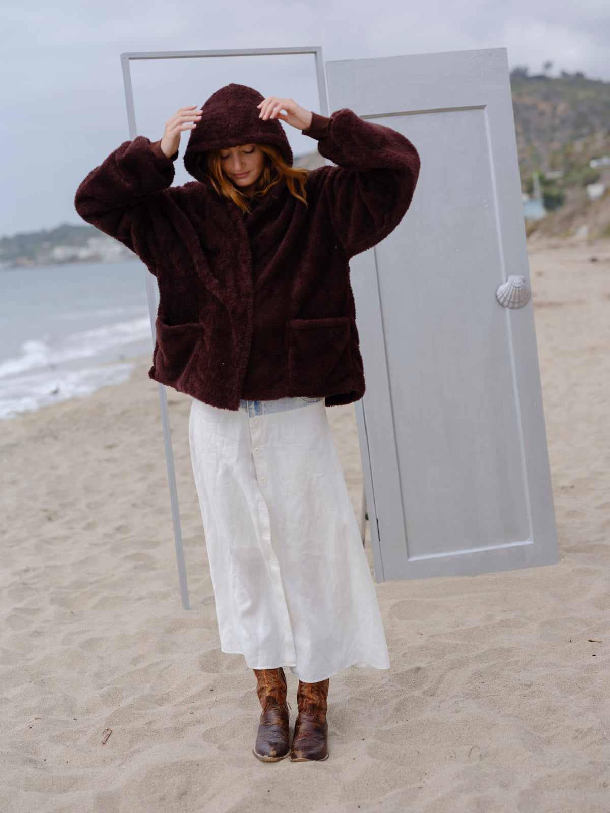 Dark Chocolate Crop Papàsweater modeled on the beach