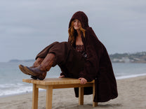 Dark Chocolate Long Papàsweater modeled on the beach