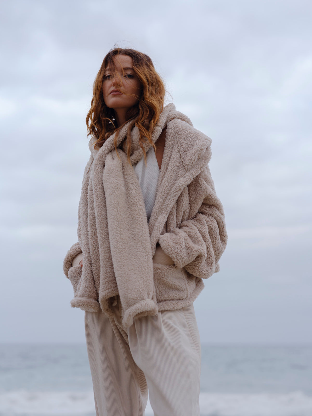 Sheep Crop Papàsweater worn open on the beach